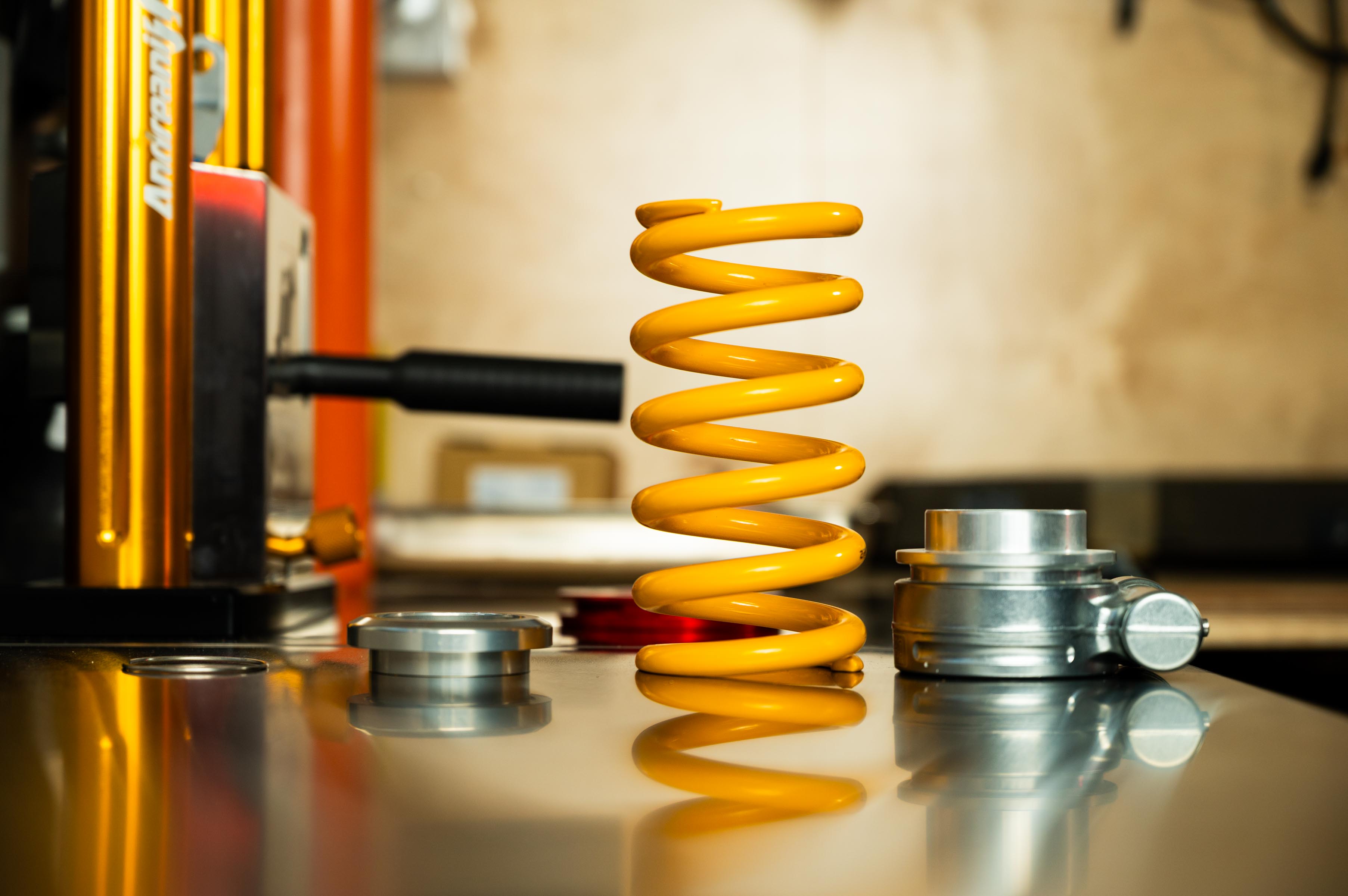 Shock absorber service including adjustment